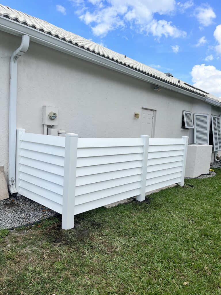 White Vinyl Providing much wanted coverage of mechanical pipes from pool heaters and air conditioners.